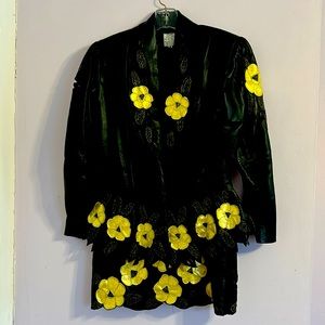 This is a fully lined leather jacket matching skirt size medium. Black gold trim